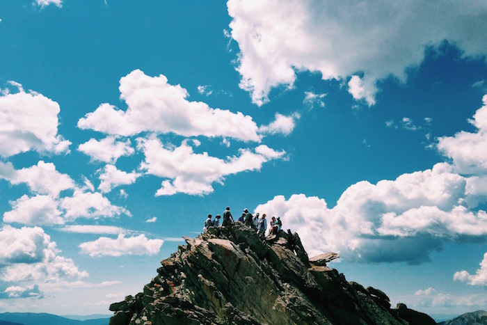 Team summiting a mountain